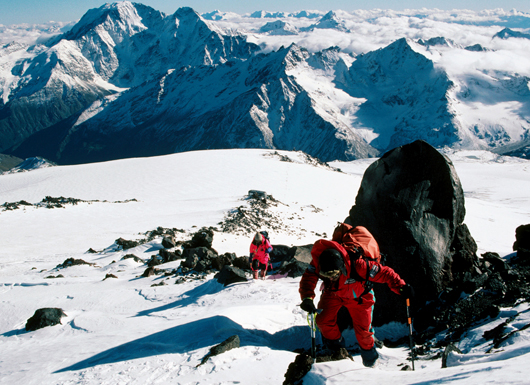 Climbers ascending mountain.