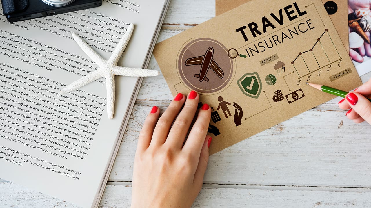 A woman is reviewing her travel insurance paper