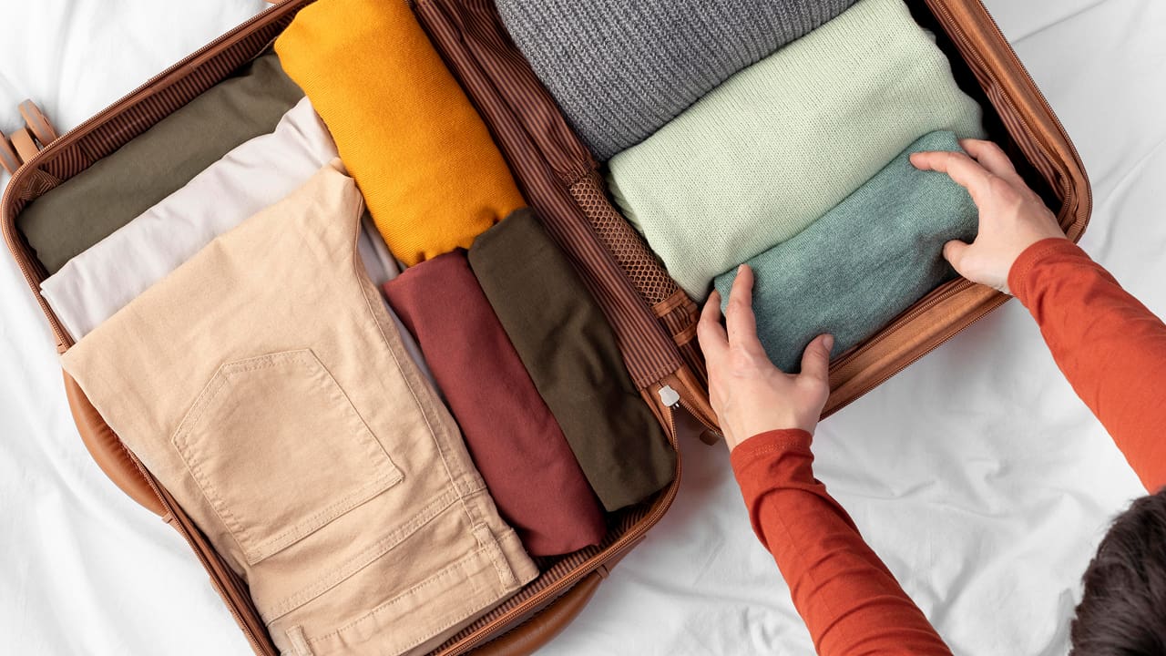 Opened luggage with folded clothes