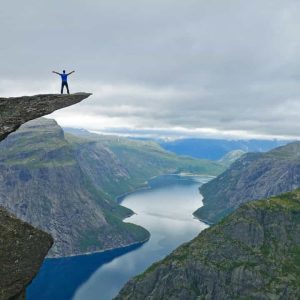Man standing on the cliff enjoying the view