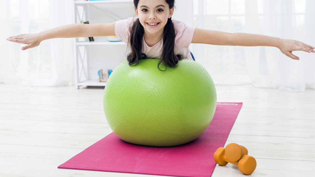 A Girl Testing Pink Gymnastics Mat