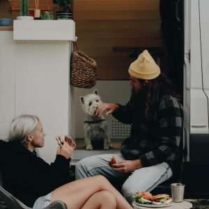 People in Black Traveling With Pet