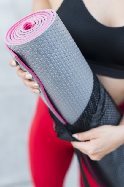 Women with workout mats