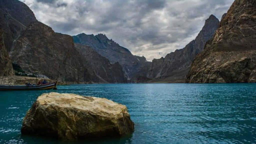 Boat and a large stone in the lake