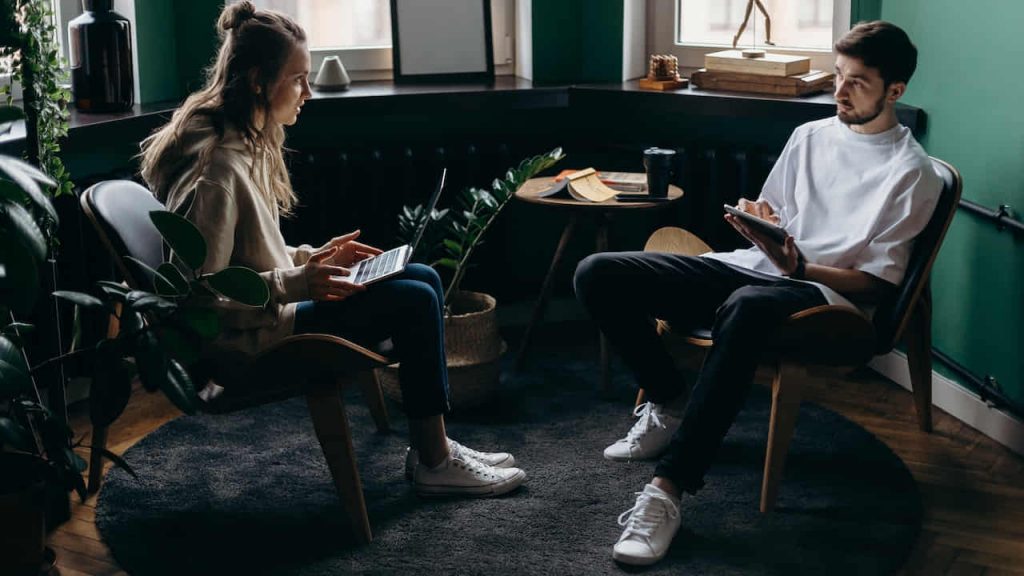 man and woman talking