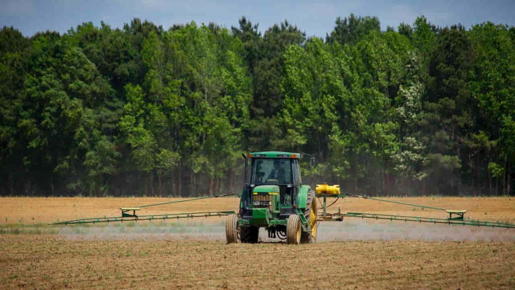 Green Tractor in Field