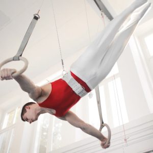 Photo of Male Gymnast Practicing on Gymnastic Rings