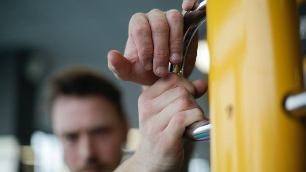 Man holding Gymnastics Bar for Home