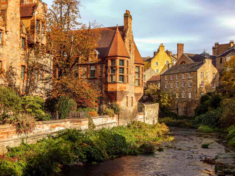 Edinburgh Scotland a river infront of historic buildings
