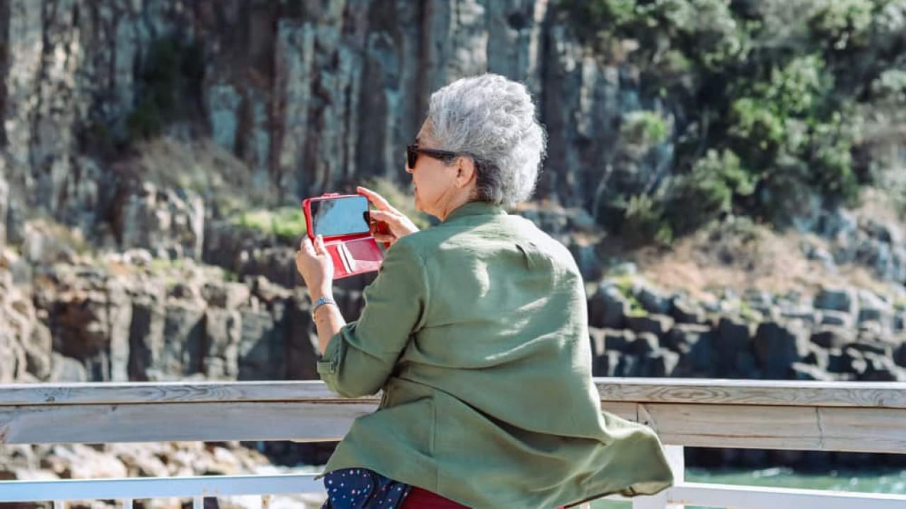 An old lady capturing photos
