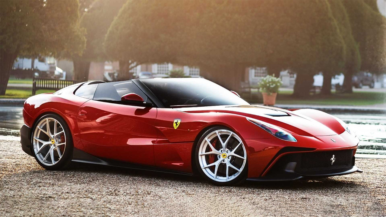 a blood red colored Ferrari F60 America  in a park