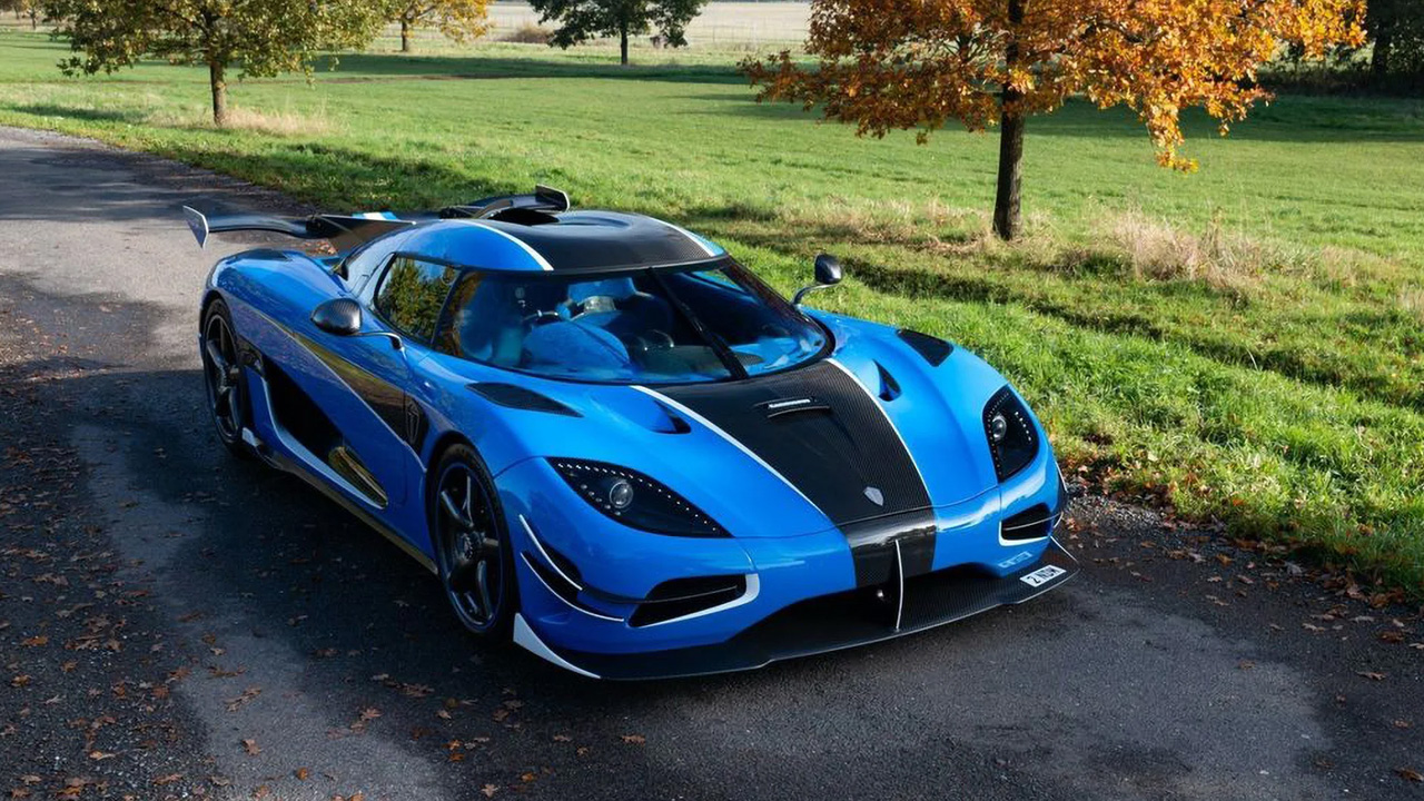 a click of blue and black colored Koenigsegg Agera RS in nature