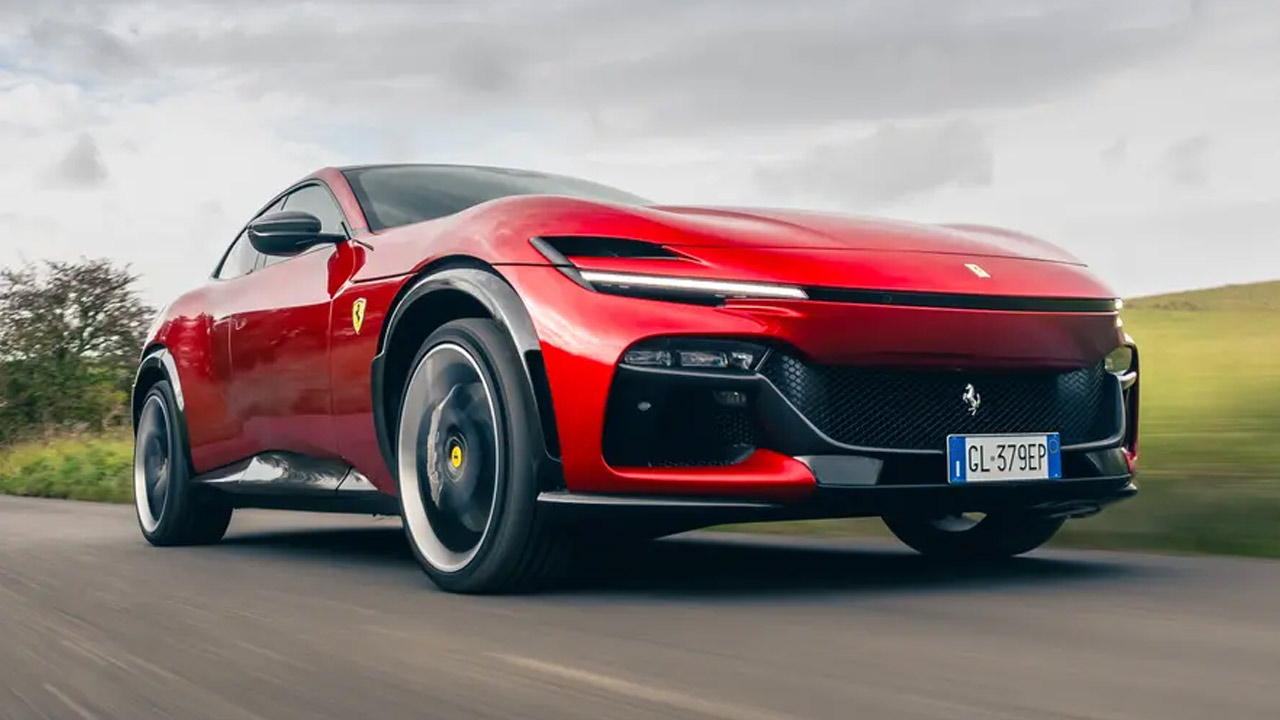 Ferrari Purosangue in blood red color running on the countryside