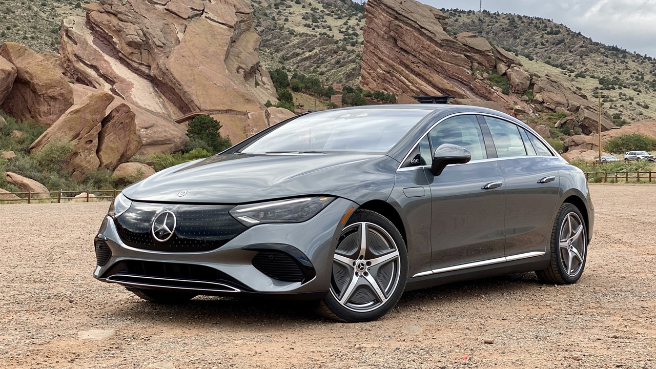 Mercedes-Benz EQE Sedan in hills and rocky mountains