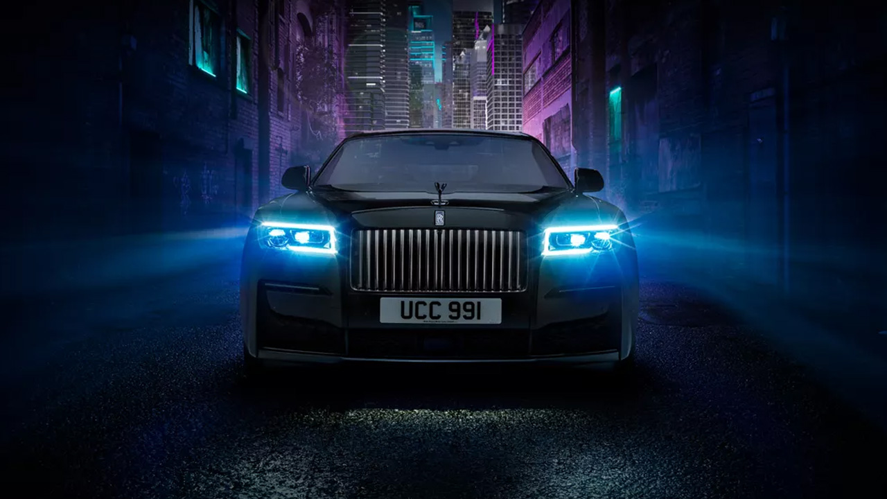 Rolls-Royce Ghost standing on the road in dark showcasing its luxurious look
