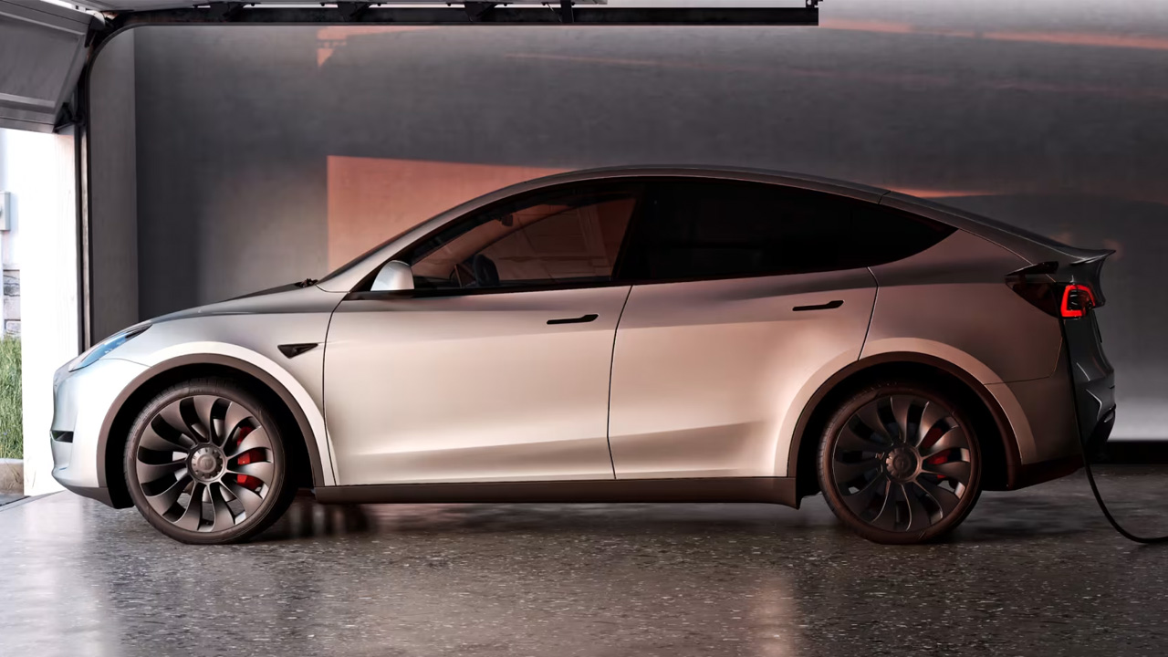 a plugged in Tesla Model Y in garage