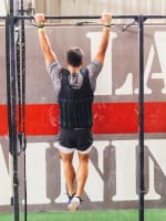 Man hanging on a pull-up bar