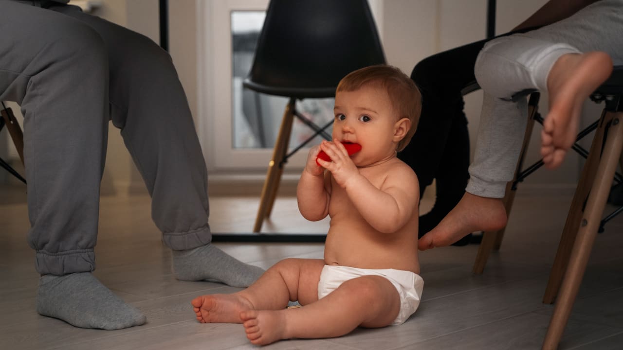 Baby sitting inside the table