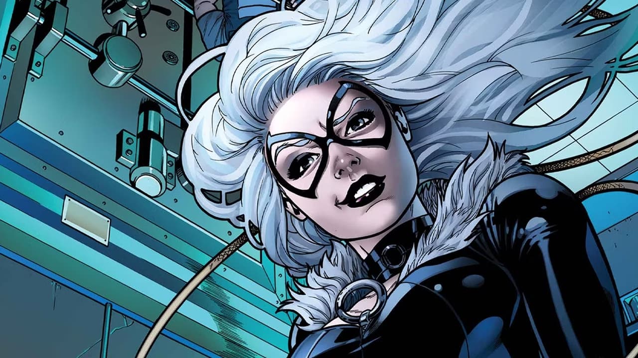 The black cat is smiling and looking down