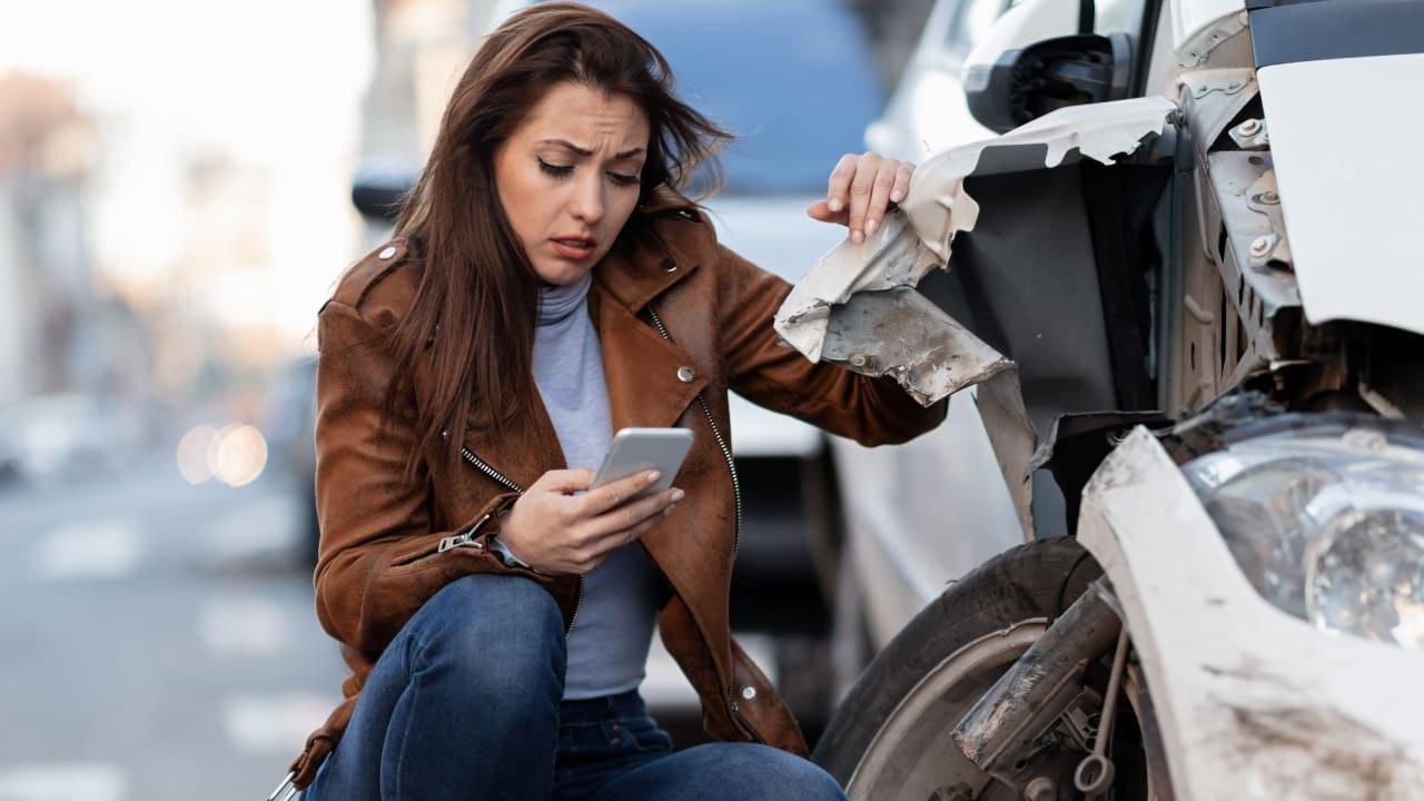 Sad women sending messages after an accident