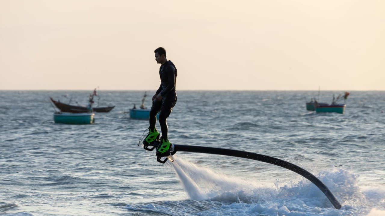 A man doing flyboarding