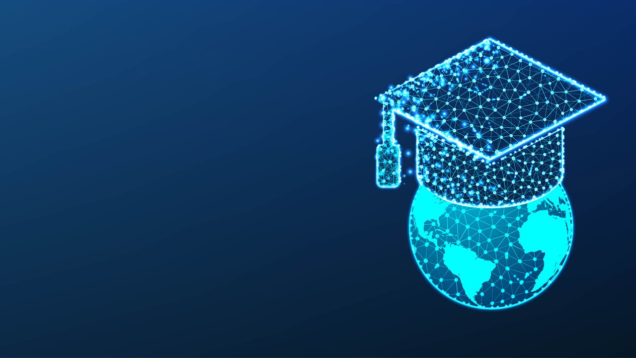 A graduation cap placed on top of a globe