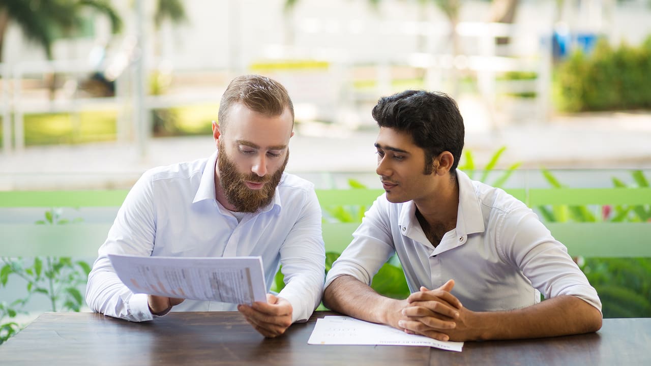 A teacher is guiding a student about fintech courses