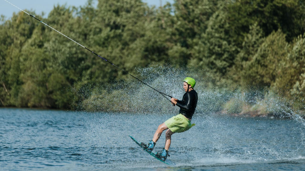 A man doing wakeboarding which is a water sport