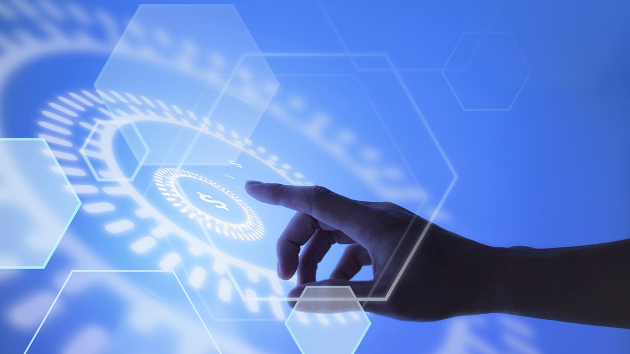 A hand pointing towards a fintech background