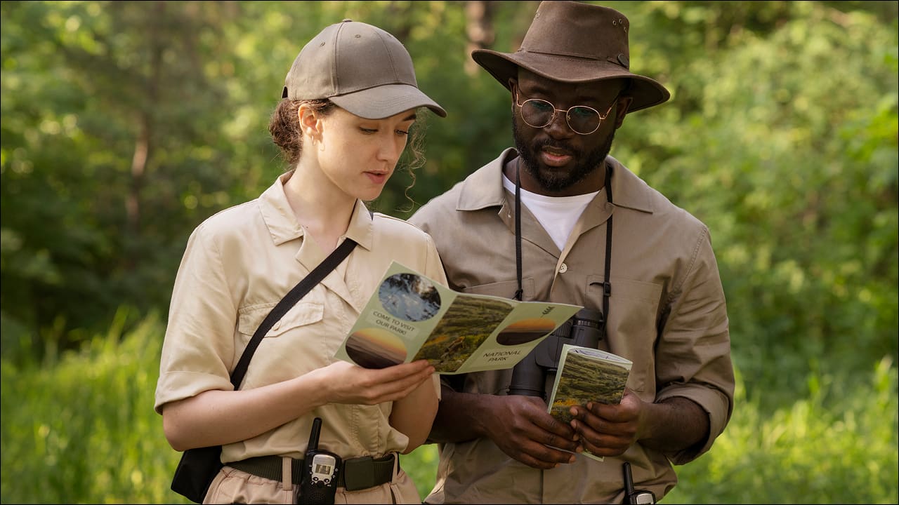 A man and a woman are reading a brochure at the Atlanta Safari Park