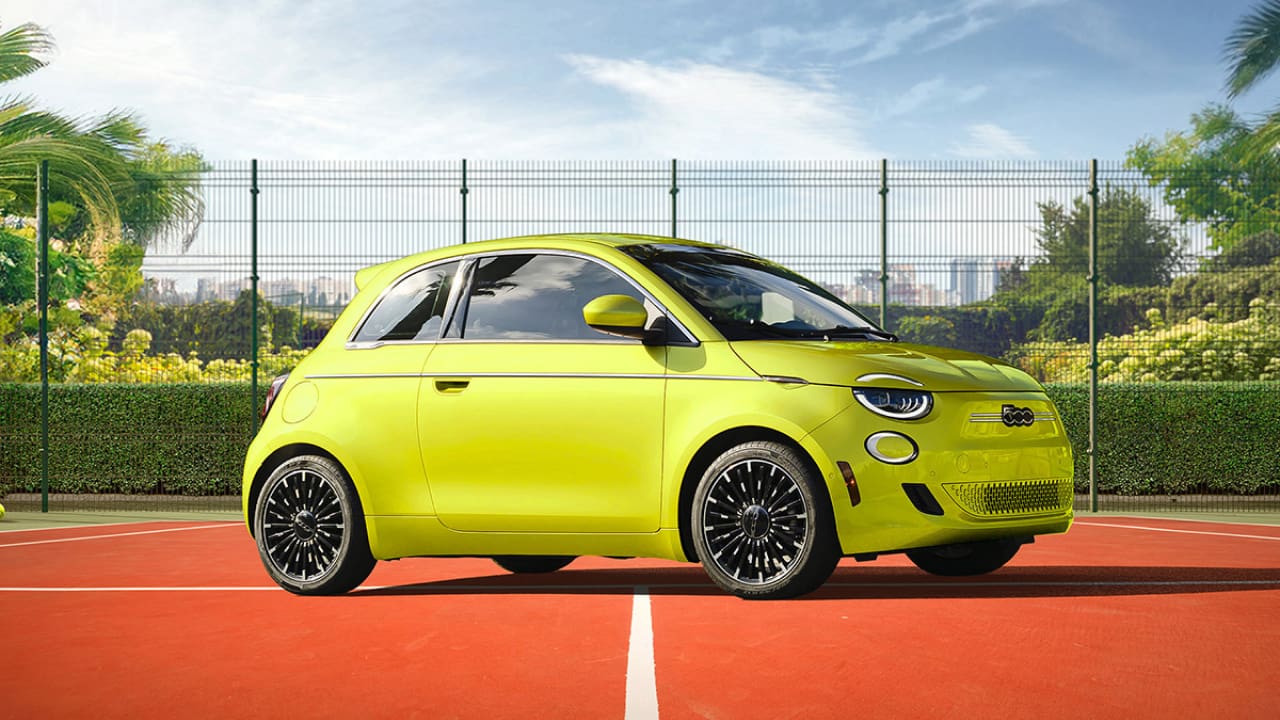 A little Fiat 500e in yellow color, smallest and cheapest electric motor