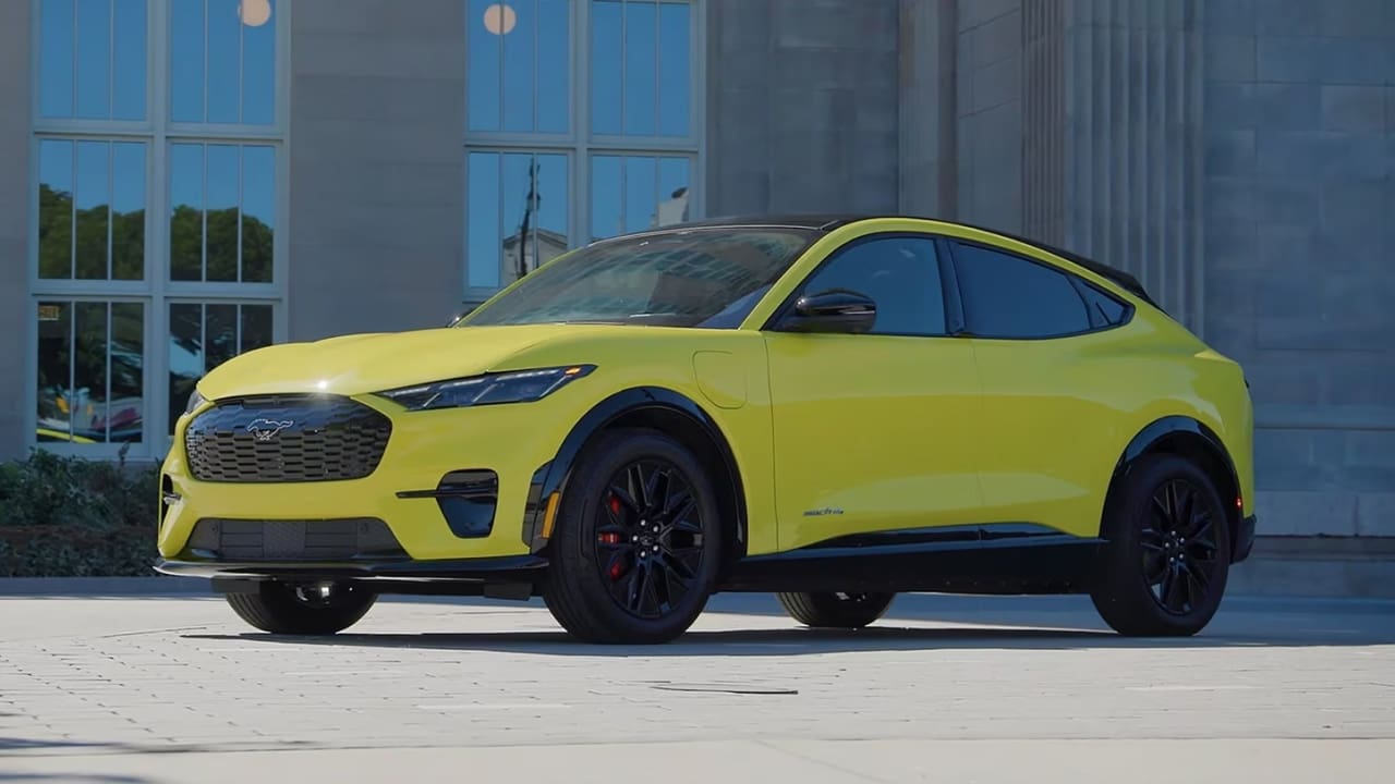 A yellow Ford Mustang Mach-E, the best family electric car being least expensive