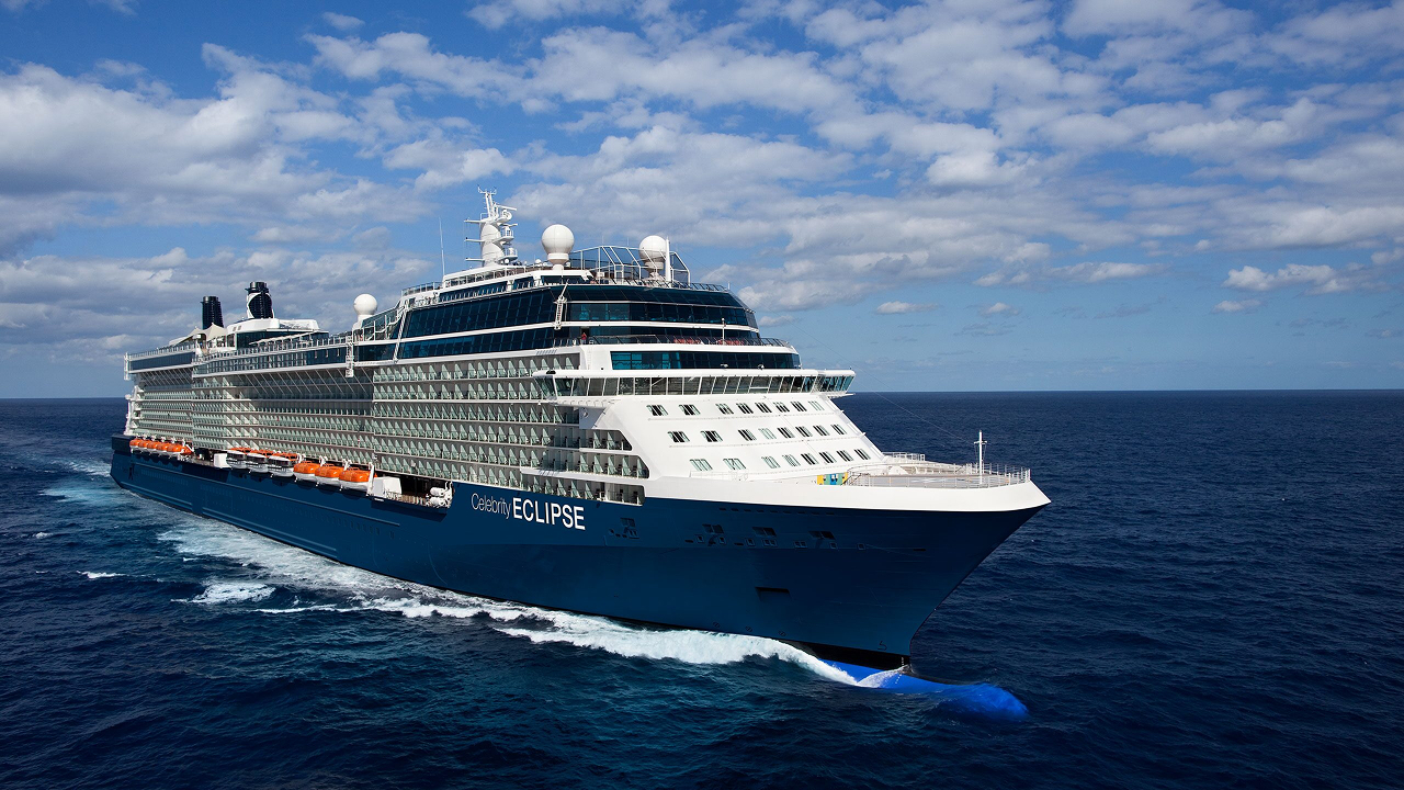 A cloudy sky, dark blue sea, and a Celebrity cruise ship sailing