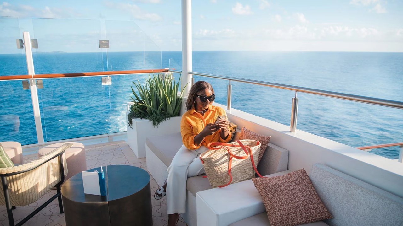 A woman relaxing on a cruise while using her phone
