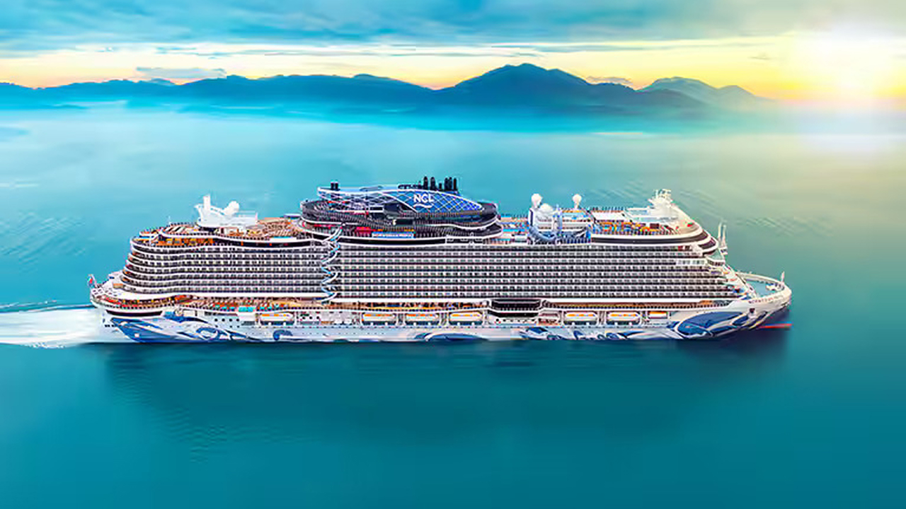A blue sea with a Norwegian ship in it