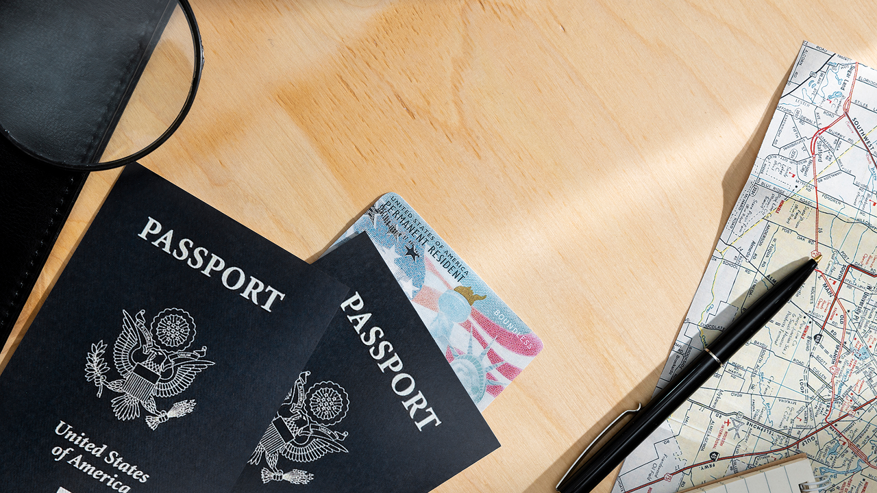 A top view of passports on a table, which are a top priority for a cruise packing list