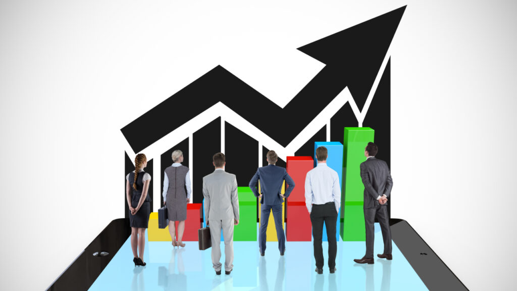 A group of people standing in front of a graph