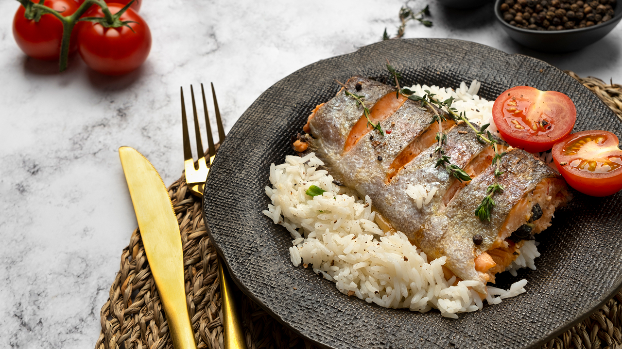 Delicious arborio rice pilaf with fish and tomatoes