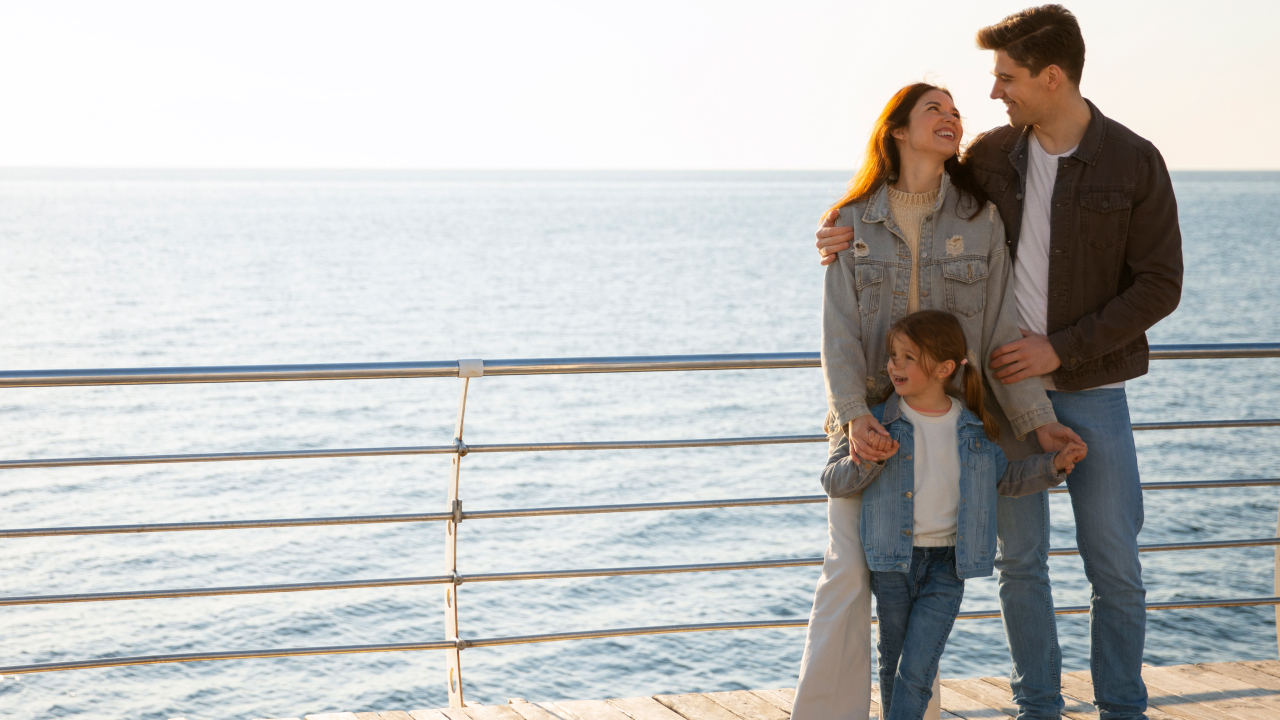 A picture of a happy family hanging out on a cruise ship