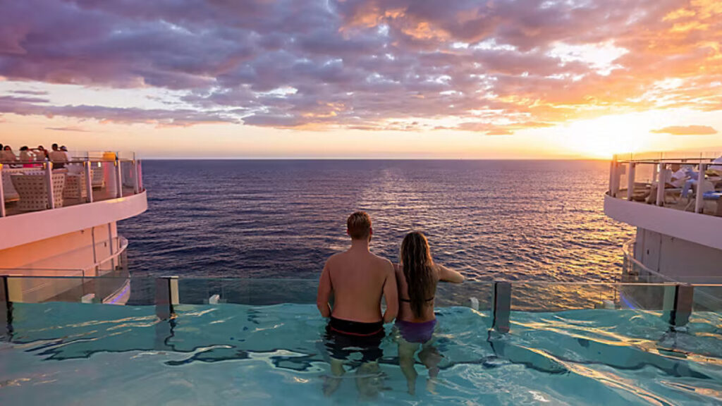 Back view of a couple in a swimming pool