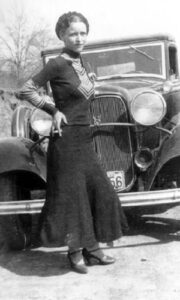 Bonnie Parker is posing with a jeep