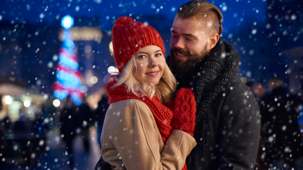 A man hugging his girlfriend on christmas eve in Salzburg, Austria