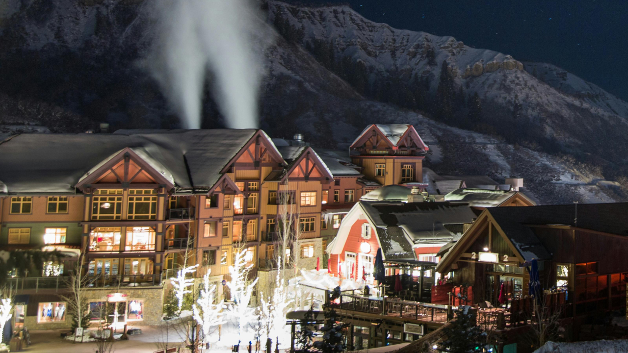 A nighttime picture of a snowy North Carolina mountain village resort