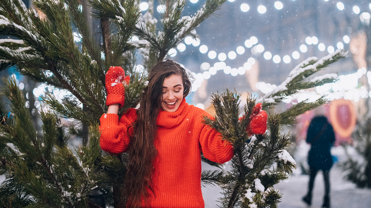 A young woman posing near the christmas tree Leavenworth, Washington, USA