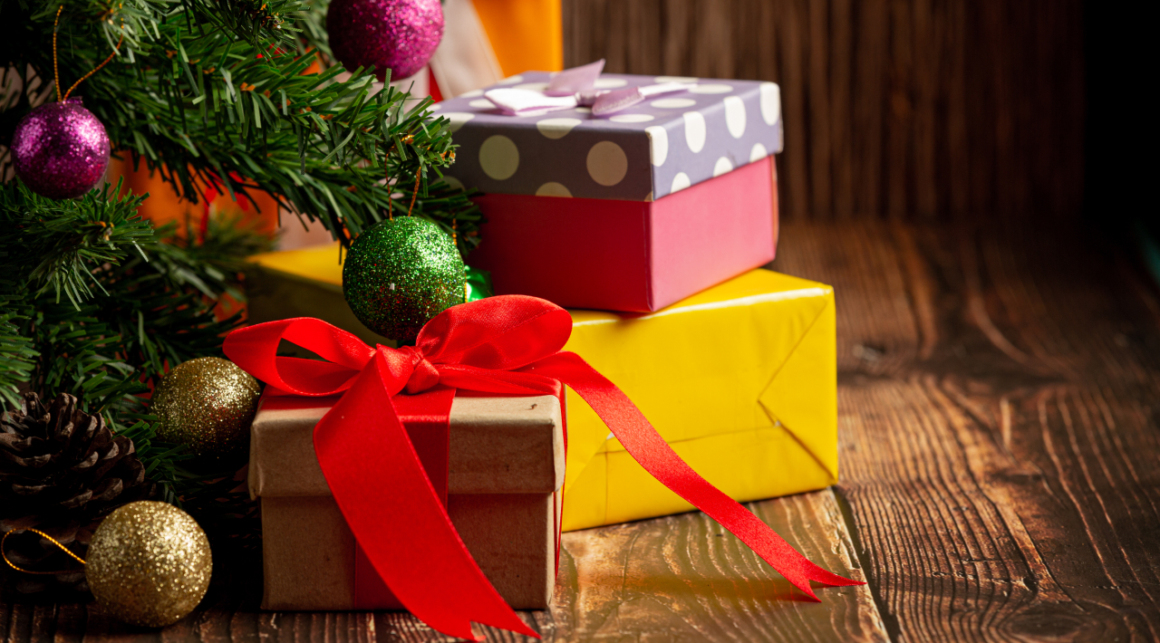 Boxes of gifts on a wooden floor