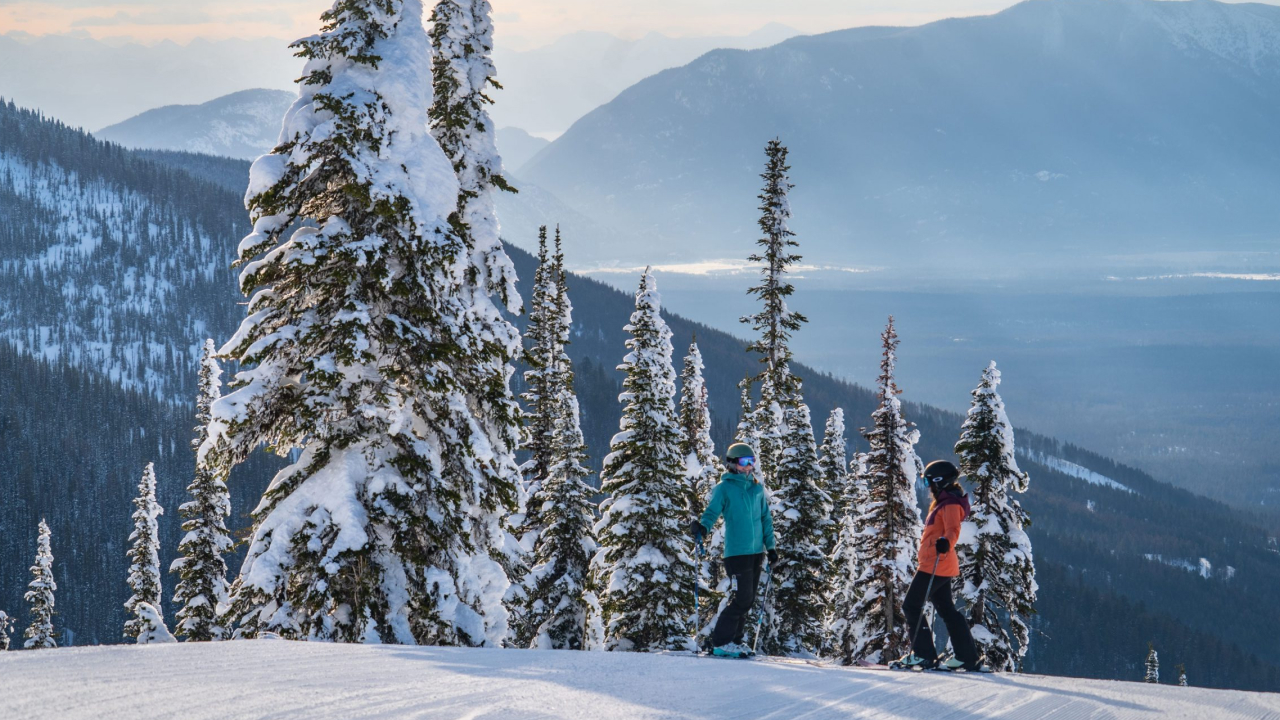 Two skiers enjoying a day at Whitefish Mountain Resort