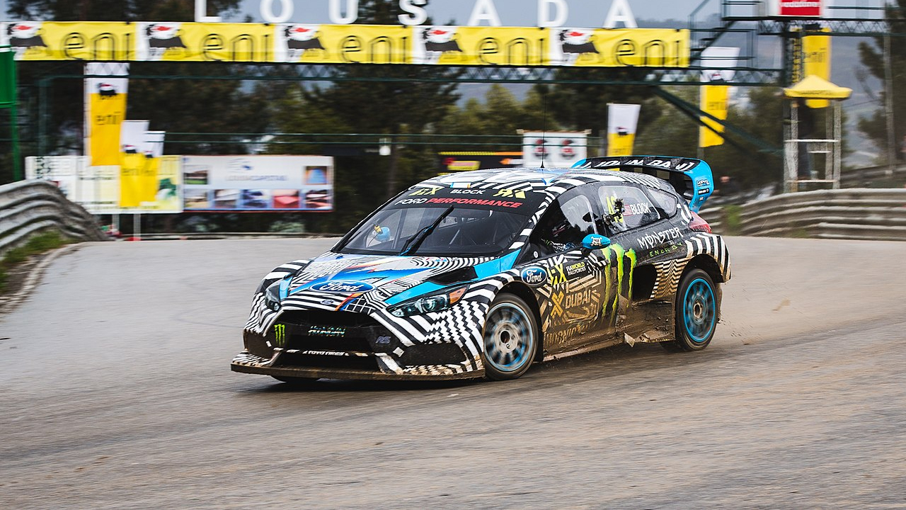 A race car drifting during a motorsport event.