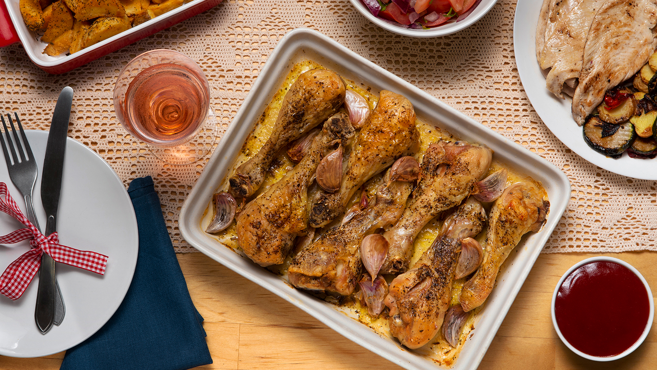 Roasted chicken drumsticks with garlic, one of the best tray bake recipes.