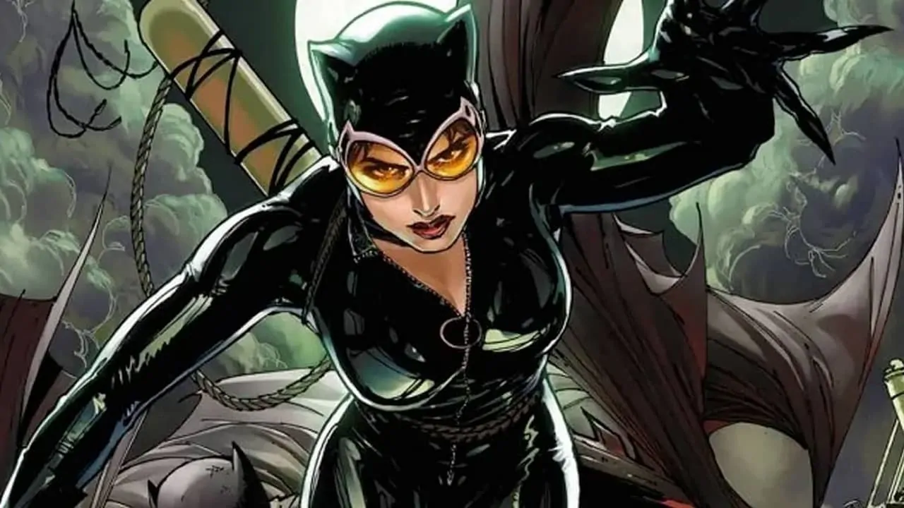 Catwoman is moving forward and trying to grab something