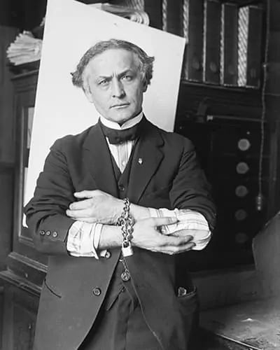 A black and white picture of harry houdini